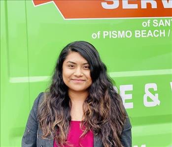 Female Smiling Green SERVPRO Van Background 