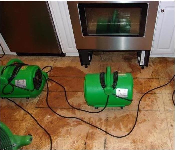 green Dehumidifiers on floor 