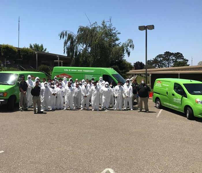 SERVPRO team stands together to start a local cleaning job